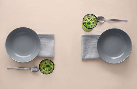 Stylish table setting on color background