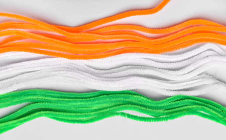Stripes in colors of Indian flag on light background