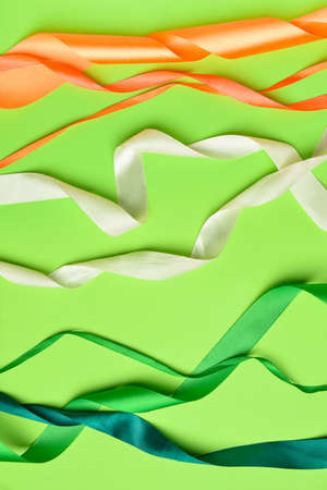 Ribbons in colors of Indian flag on green background