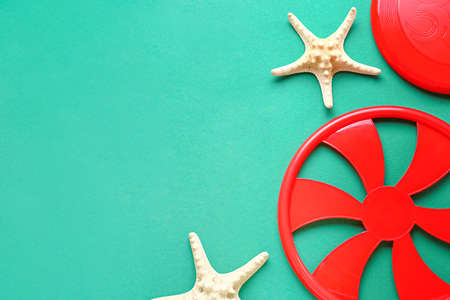 Flying discs and starfishes on color backgroundの写真素材