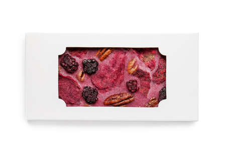 Handmade chocolate bar with fruits, berries and nuts on white background