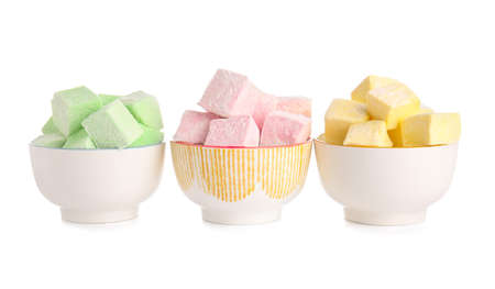 Bowls with tasty sweet marshmallows on white backgroundの写真素材