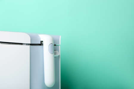 Modern deep fryer on color backgroundの写真素材