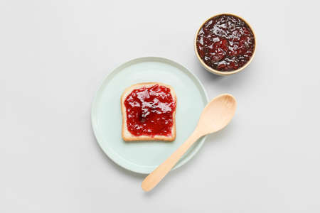 Tasty sandwich with cherry jam on light backgroundの写真素材