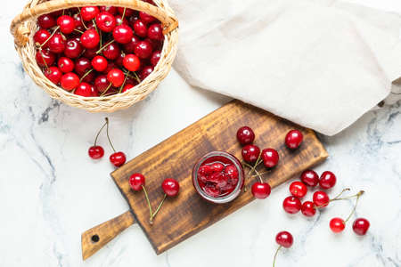 Composition with ripe cherry and jam on light backgroundの写真素材