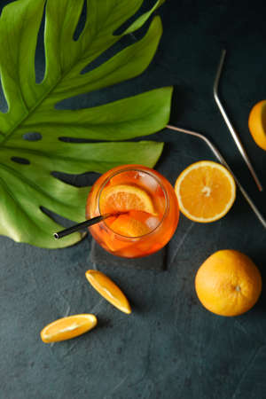 Glass of tasty aperol spritz cocktail on dark backgroundの写真素材