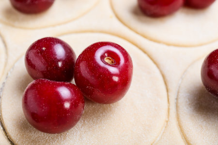Fresh dough for cherry dumplings on table, closeupの写真素材