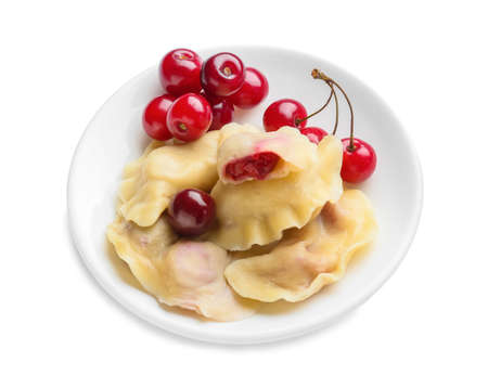 Plate with tasty cherry dumplings on white backgroundの写真素材