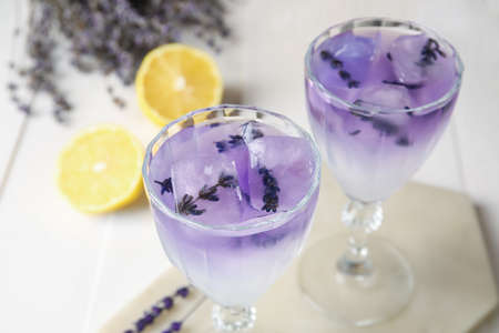 Glasses of fresh cocktail with lavender on table, closeupの写真素材