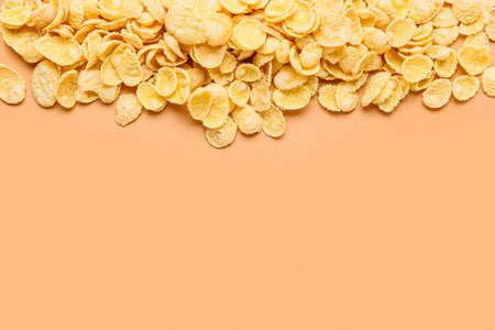 Heap of tasty cornflakes on color background