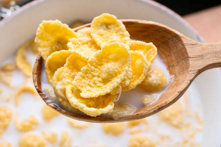Spoon with tasty cornflakes, closeup