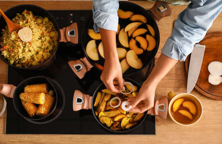 Woman preparing dinner in the kitchenの写真素材