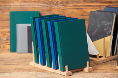 Organizer with books on wooden backgroundの写真素材