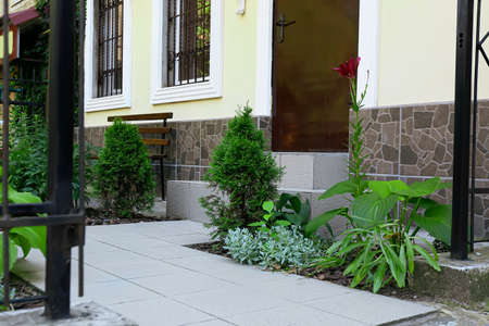 View of modern building with door, stairs and beautiful landscape designの写真素材