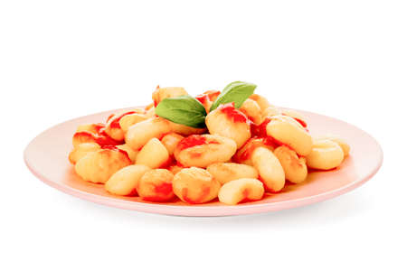 Plate with tasty gnocchi on white backgroundの写真素材