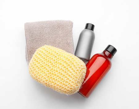 Cosmetics, towel and bath sponge on white backgroundの写真素材