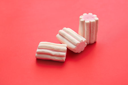 Tasty marshmallows on color backgroundの写真素材