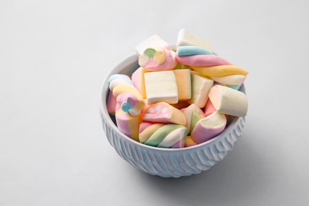 Bowl with tasty marshmallows on gray backgroundの写真素材