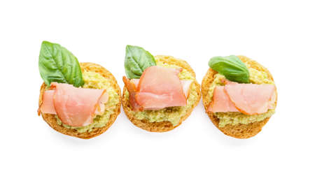 Tasty sandwiches with guacamole and ham on white backgroundの写真素材