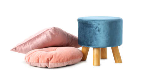 Blue pouf with pink pillows on white backgroundの写真素材
