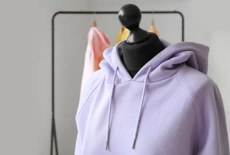 Mannequin with lilac hoodie in modern room, closeupの写真素材