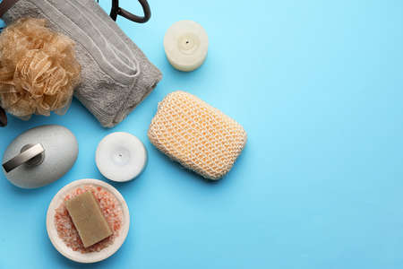 Bath supplies with sponge on color background