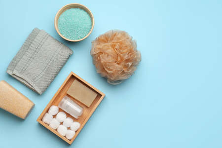 Bath supplies with sponge on color background