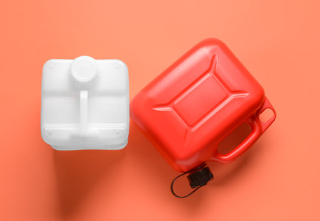 Plastic jerry cans on color background