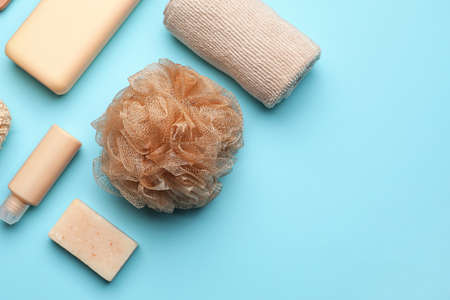 Bath supplies with sponge on color background