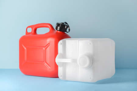 Plastic jerry cans on color backgroundの写真素材