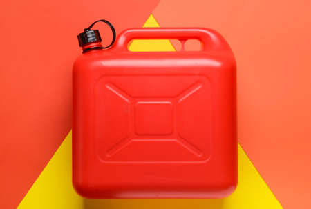 Plastic jerry can on color backgroundの写真素材