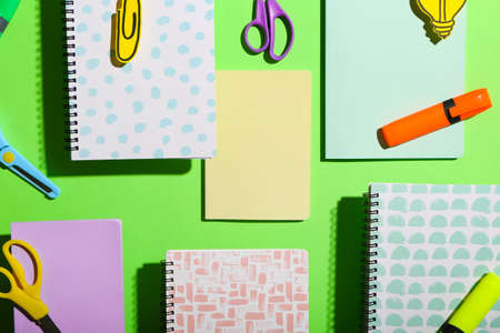 Stationery supplies on color background