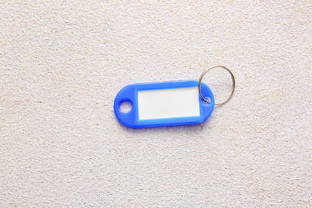Plastic key tag on light backgroundの写真素材
