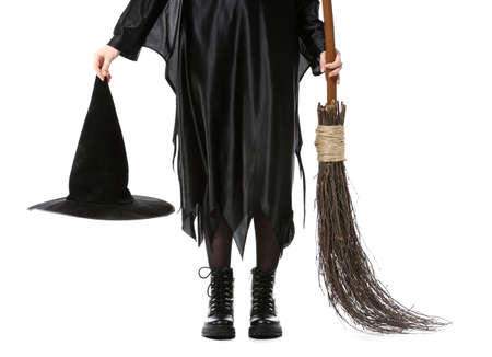 Beautiful woman dressed as witch for Halloween on white backgroundの写真素材