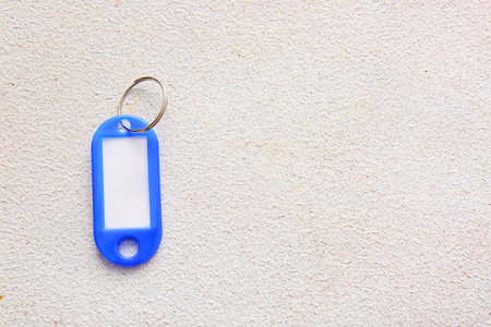 Plastic key tag on light backgroundの写真素材