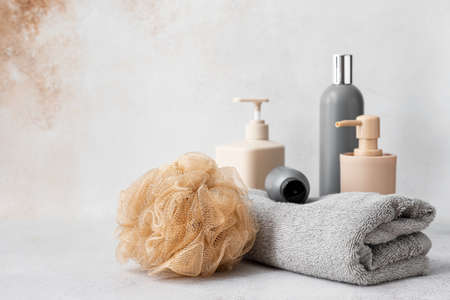 Set of bath accessories and soft sponge on light backgroundの写真素材