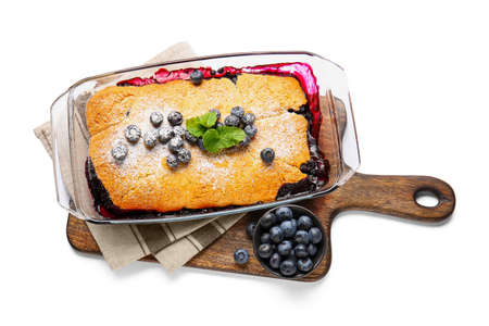 Baking dish with blueberry cobbler on white backgroundの写真素材