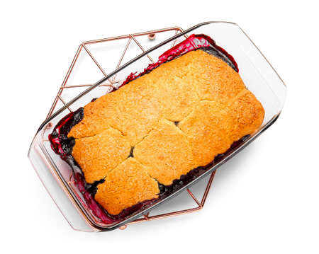 Baking dish with blueberry cobbler on white backgroundの写真素材