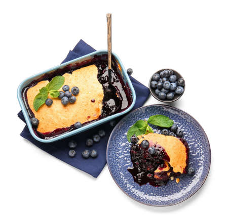 Baking dish with blueberry cobbler on white backgroundの写真素材