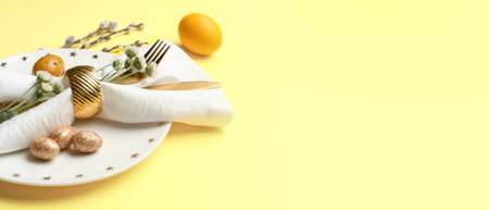 Stylish Easter table setting on yellow background with space for text