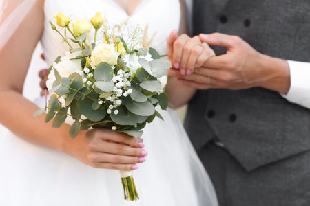 Happy young bride with her groom, closeup