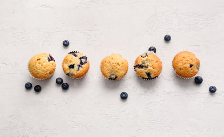 Tasty blueberry muffins on light backgroundの写真素材