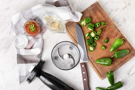 Blender and ingredients for delicious jalapeno pepper jam on light table