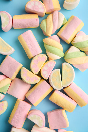 Tasty marshmallows on color background, closeupの写真素材