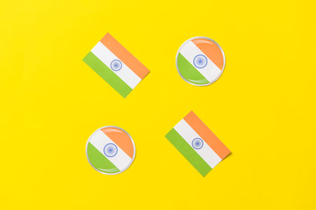 Paper Indian flags on color background