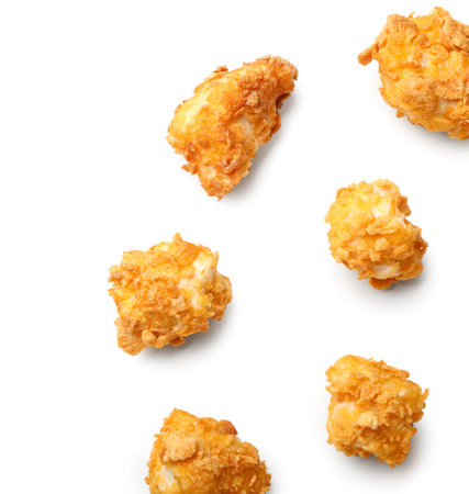 Tasty crunchy popcorn chicken on white backgroundの写真素材