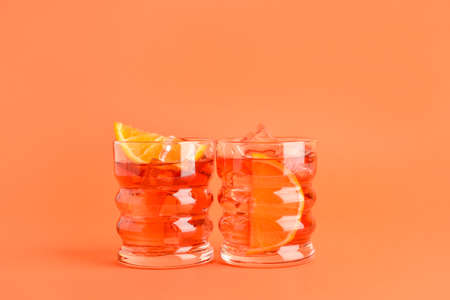 Glasses of tasty Negroni cocktail on color backgroundの写真素材