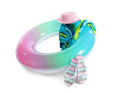 Inflatable ring, towel, hat and flip-flops on white background