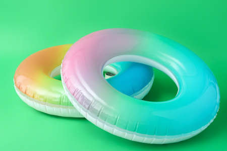 Inflatable rings on color background