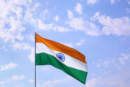 Waving flag of India on blue sky backgroundの写真素材